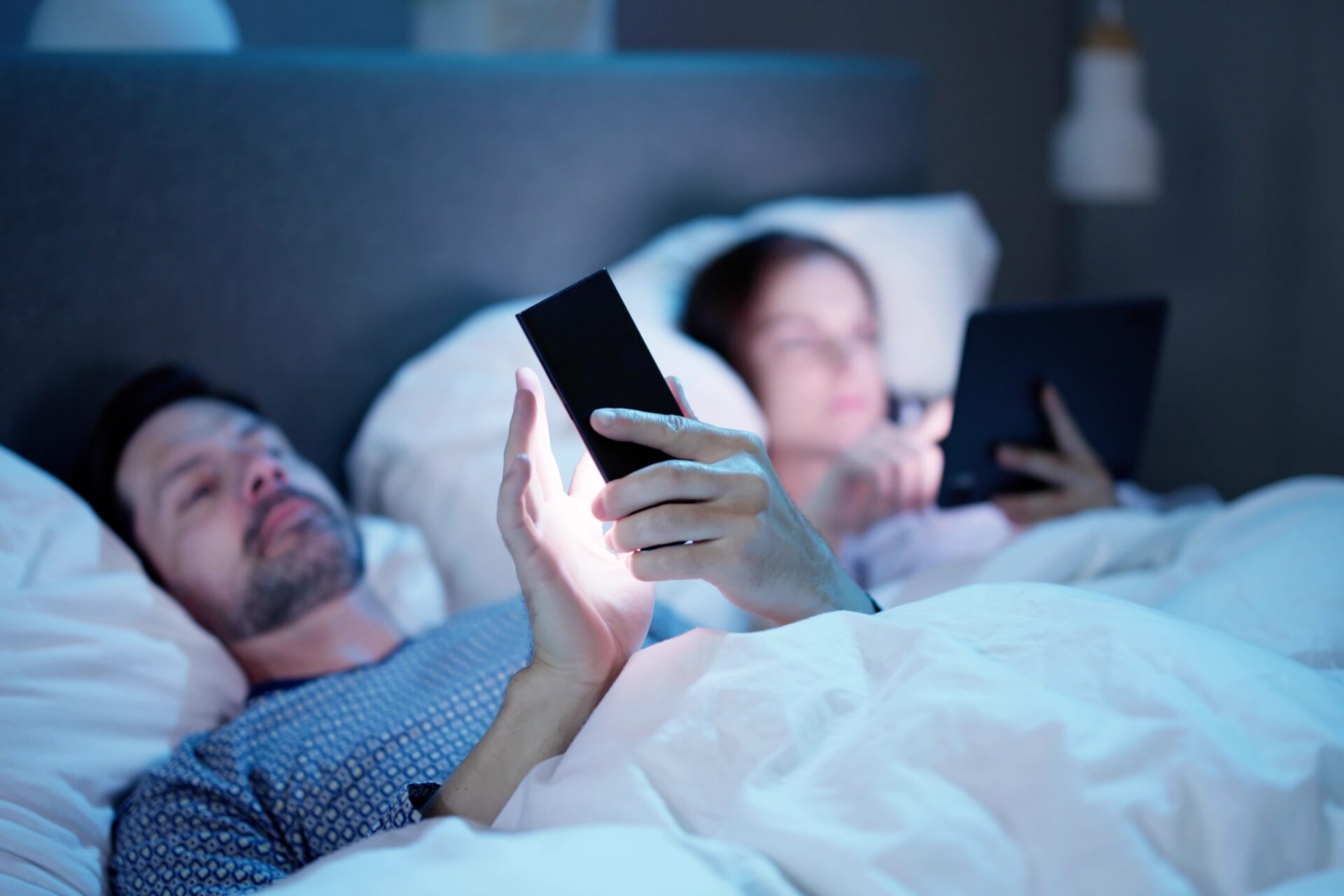 62224965-watching-cell-phone-before-sleep-at-night